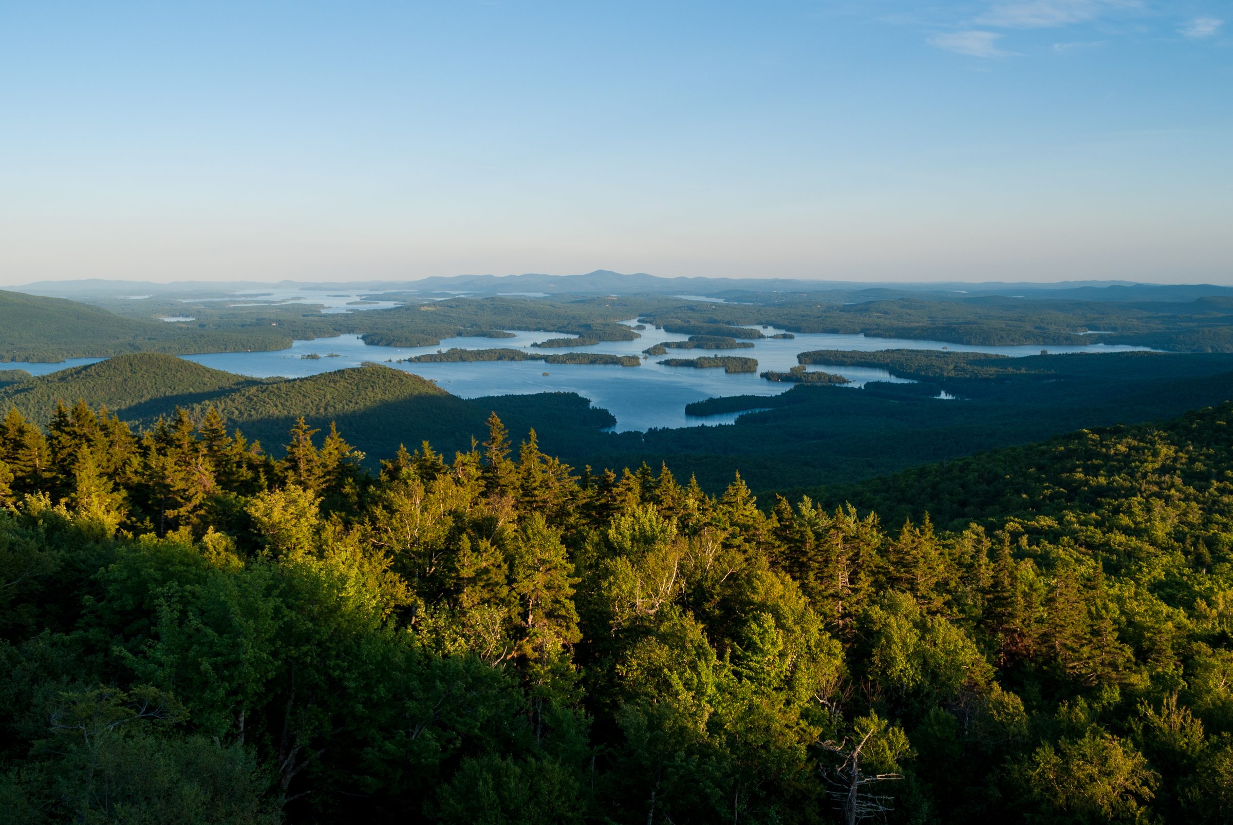 The Lakes Region from above, forested points and open water