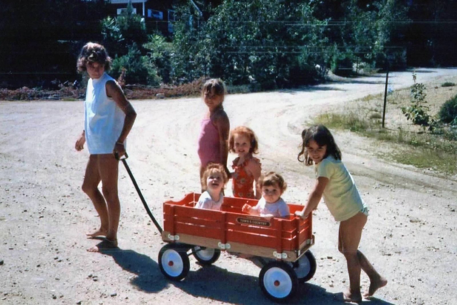 The little ones towed in the red wagon