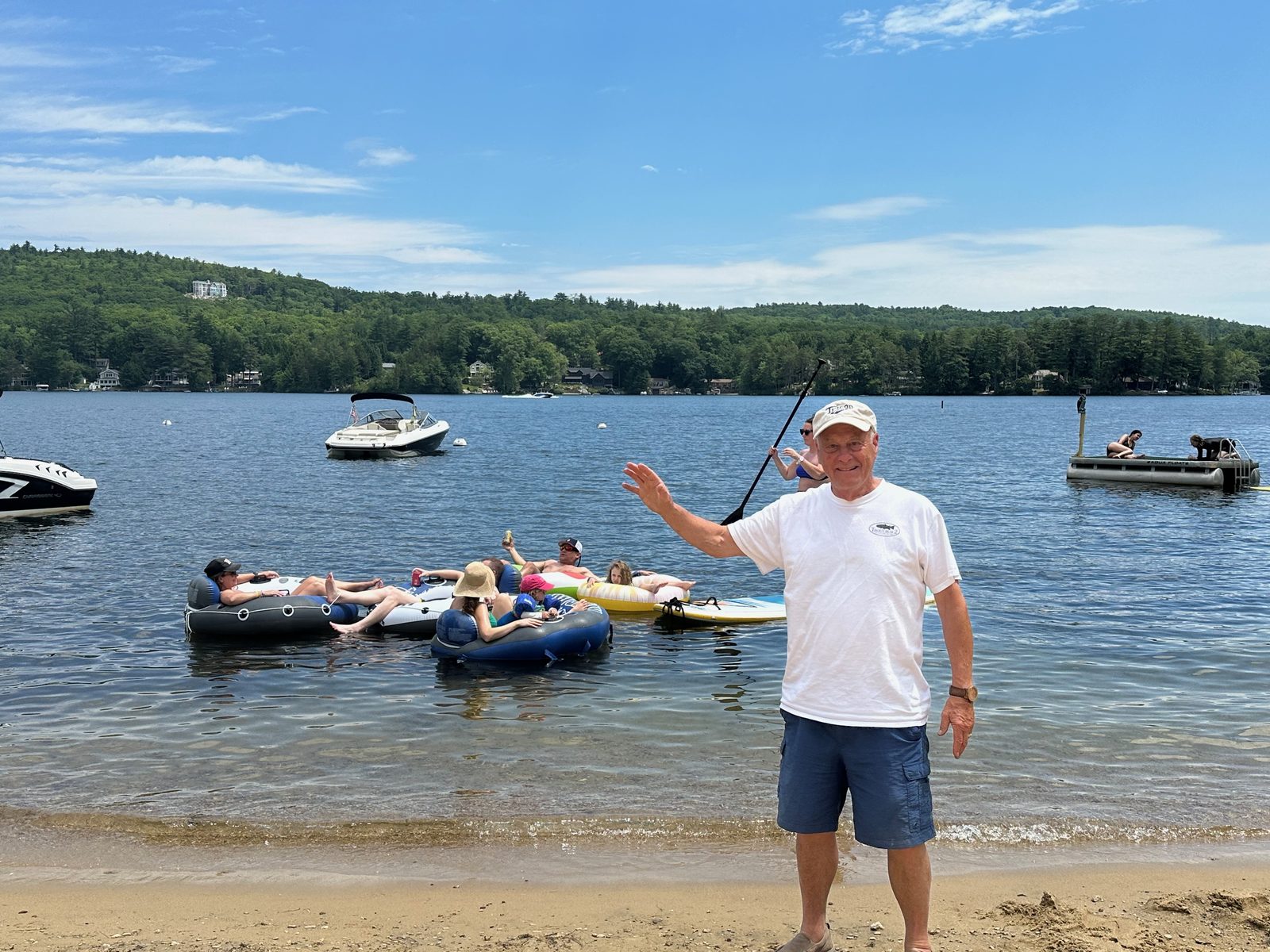 Eric, waving from the beach while everyone floats