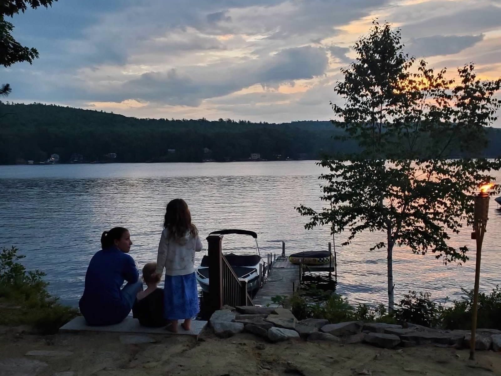 The family on the rock ledge at golden hour